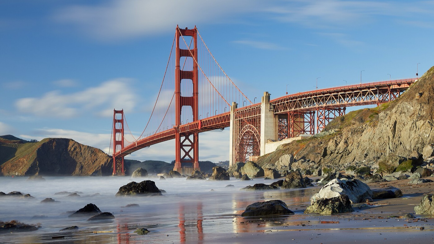 Golden Gate Bridge and San Francisco Bay representing a city with distinct neighborhood and property-type markets
